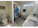 Bathroom featuring a double sink vanity, turtle themed shower curtain and tile flooring at 1287 Northcraft Ct, Franklin, IN 46131