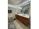 Bathroom featuring a double sink vanity, turtle themed shower curtain and tile flooring at 1287 Northcraft Ct, Franklin, IN 46131