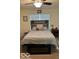 Bedroom with gray and white bedding, modern wood headboard, and plenty of natural light at 1287 Northcraft Ct, Franklin, IN 46131