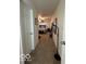 Hallway leading to bedroom with carpet floors, neutral paint, and updated lighting at 1287 Northcraft Ct, Franklin, IN 46131