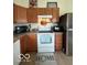 Bright kitchen featuring matching appliances and wooden cabinets with updated countertops at 1287 Northcraft Ct, Franklin, IN 46131
