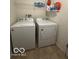 Functional laundry room with washer, dryer, and shelving ensures efficient home management at 1287 Northcraft Ct, Franklin, IN 46131