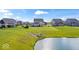 The backyard is large and extends to a body of water at 13410 Mancroft Dr, Fishers, IN 46037
