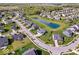 Neighborhood aerial view showcasing the pond, street layout, and surrounding landscape at 13410 Mancroft Dr, Fishers, IN 46037