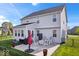 A patio with rocking chairs and an umbrella is visible in the fenced in backyard at 13410 Mancroft Dr, Fishers, IN 46037