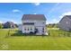 The exterior of the home features a large fenced-in backyard and back patio at 13410 Mancroft Dr, Fishers, IN 46037