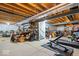 Unfinished basement featuring exposed beams, workout equipment, and plenty of storage space at 13410 Mancroft Dr, Fishers, IN 46037