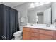 Bathroom with double sink vanity, a shower with a black curtain, and neutral walls at 13410 Mancroft Dr, Fishers, IN 46037