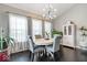 Bright dining area with stylish chandelier, large windows, and comfortable seating at 13410 Mancroft Dr, Fishers, IN 46037