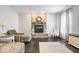 Cozy living room features a stone fireplace, hardwood floors, and comfortable seating at 13410 Mancroft Dr, Fishers, IN 46037