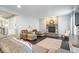 Inviting living room boasts a stone fireplace, plush seating, and hardwood flooring at 13410 Mancroft Dr, Fishers, IN 46037