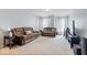 Comfortable living room featuring two sofas, a TV, and bright natural lighting at 13410 Mancroft Dr, Fishers, IN 46037