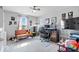 Home office with a desk setup, light-colored carpet, and windows for natural light at 13410 Mancroft Dr, Fishers, IN 46037