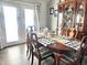 Bright dining room features a wooden table and chairs, along with a vintage hutch and inviting decor at 135 Crestwood Ave, Crawfordsville, IN 47933
