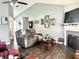 Inviting living room featuring a fireplace, vaulted ceiling, and comfortable seating, creating a cozy atmosphere at 135 Crestwood Ave, Crawfordsville, IN 47933