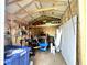 Inside the backyard storage shed; a variety of lawn and garden equipment is neatly stored on shelves at 135 Crestwood Ave, Crawfordsville, IN 47933