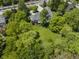 Lush landscaping surrounds this beautiful home, set back from the road for privacy and a serene outdoor living experience at 13909 Springmill Rd, Carmel, IN 46032