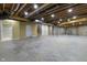 Unfinished basement with exposed ceiling presents customizable space for future living with potential stairwell access at 13909 Springmill Rd, Carmel, IN 46032