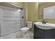Bathroom boasts shower, modern vanity with black fixtures, and tile flooring, offering convenience at 13909 Springmill Rd, Carmel, IN 46032