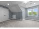 Sloped ceiling bedroom with carpet, closet, and window at 13909 Springmill Rd, Carmel, IN 46032