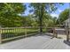 A nice composite deck with access to the house and the surrounding backyard and lawn at 13909 Springmill Rd, Carmel, IN 46032