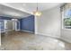 Elegant dining room featuring tile flooring, chandelier lighting, and natural light at 13909 Springmill Rd, Carmel, IN 46032