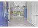 Bright foyer with tile floors, high ceilings, and a glimpse into the open living space at 13909 Springmill Rd, Carmel, IN 46032