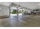 Spacious three-car garage offers ample parking and storage; natural light floods the interior when doors are fully open at 13909 Springmill Rd, Carmel, IN 46032
