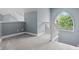 Hallway with grey carpet, white banister, and arched window at 13909 Springmill Rd, Carmel, IN 46032