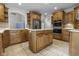 Well-appointed kitchen with a center island, stainless steel appliances, and ample cabinet space at 13909 Springmill Rd, Carmel, IN 46032