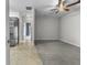 An open floor plan reveals the living room's neutral carpet and a ceiling fan, adjacent to the kitchen at 13909 Springmill Rd, Carmel, IN 46032