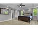 Large main bedroom features recessed lighting, ceiling fan, and stylish barn door at 13909 Springmill Rd, Carmel, IN 46032
