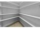 Walk-in pantry with custom shelving offering ample storage space for kitchen essentials at 13909 Springmill Rd, Carmel, IN 46032