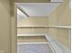 Organized storage room features built-in shelving and neutral paint, offering practical and tidy solutions at 13909 Springmill Rd, Carmel, IN 46032
