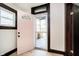 A welcoming entryway with a pink front door and neutral walls at 1402 Olive St, Indianapolis, IN 46203