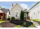 Charming single-story home with a well-maintained lawn and inviting front porch at 1402 Olive St, Indianapolis, IN 46203
