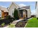 Charming single-story home with a well-maintained lawn and inviting front porch at 1402 Olive St, Indianapolis, IN 46203