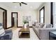 A stylish living room featuring modern furniture, light wood floors and neutral walls at 1402 Olive St, Indianapolis, IN 46203