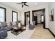 A stylish living room featuring modern furniture, light wood floors and neutral walls at 1402 Olive St, Indianapolis, IN 46203