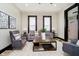 A stylish living room featuring modern furniture, light wood floors and neutral walls at 1402 Olive St, Indianapolis, IN 46203