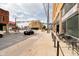 An attractive street view of a vintage brick building with outdoor seating in a vibrant urban neighborhood at 1402 Olive St, Indianapolis, IN 46203