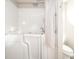 Accessible bathroom featuring a walk-in tub and shower combo at 143 Asbury Dr # 86A, Anderson, IN 46013