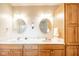 Bathroom with double vanity, marble countertop and traditional oak cabinet at 143 Asbury Dr # 86A, Anderson, IN 46013