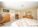 Bedroom with a bed, dresser, and flatscreen TV. Attached bathroom door visible at 143 Asbury Dr # 86A, Anderson, IN 46013