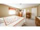 Bedroom features a window, tv, wooden furniture and a quilted bedspread at 143 Asbury Dr # 86A, Anderson, IN 46013