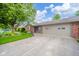 Attractive home with an attached garage and beautifully landscaped front yard at 143 Asbury Dr # 86A, Anderson, IN 46013
