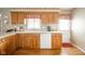 Bright kitchen featuring oak cabinets, white countertops, and modern appliances at 143 Asbury Dr # 86A, Anderson, IN 46013