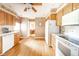 Bright kitchen with white appliances and wood cabinets at 143 Asbury Dr # 86A, Anderson, IN 46013