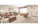 Warm living room with a large window and well-coordinated furniture at 143 Asbury Dr # 86A, Anderson, IN 46013