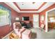 Cozy living room features tray ceilings, plush seating and TV at 143 Asbury Dr # 86A, Anderson, IN 46013